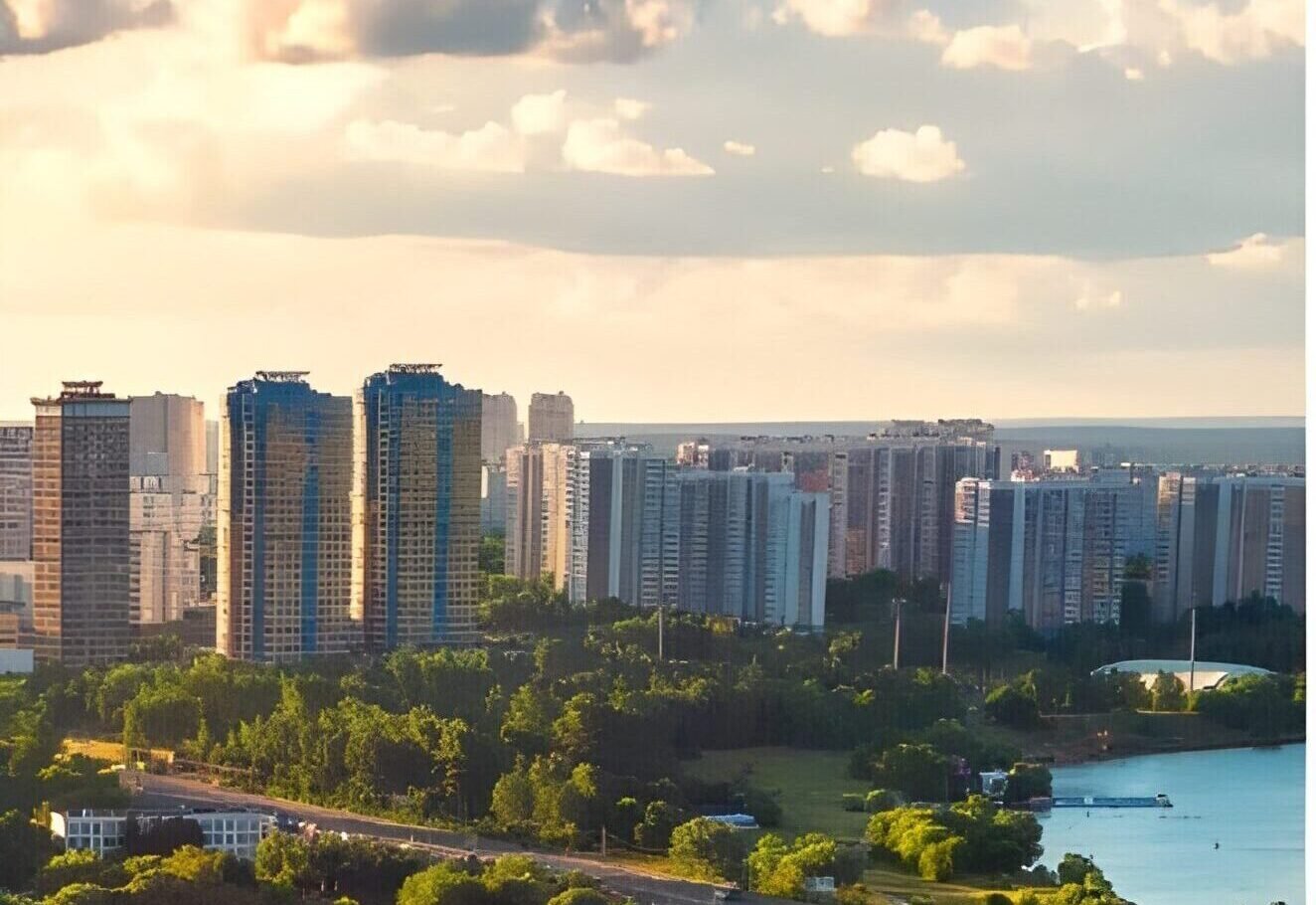 Aerial view of a modern city skyline with tall buildings under a clear blue sky
